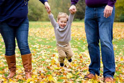 Smiling Child Being Swung By Parents Family Photo NV Holden Photography